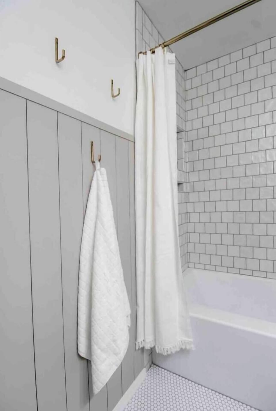 Modern master ensuite with a spacious walk-in shower and stylish tile accents!