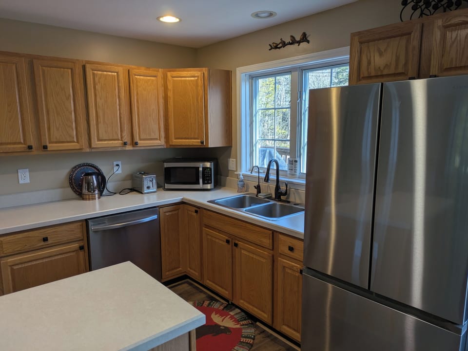 Well-stocked kitchen; Gas grill is located on the deck outside the sliding door