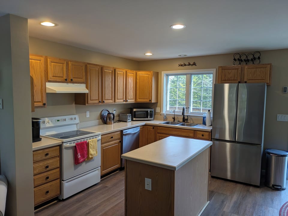 Well-stocked kitchen; Gas grill is located on the deck outside the sliding door