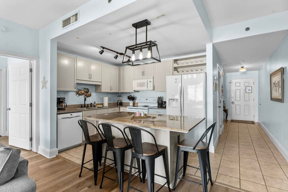 Open Concept, Fully Stocked Kitchen with Fridge, Freezer, Stove, Microwave, Drip Coffee Maker and Island Bar Seating