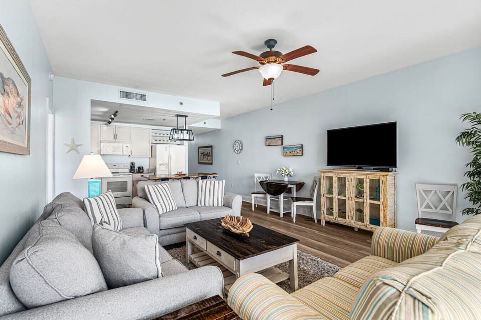 Open Concept Living Area with Sleeper Sofa, Flat Screen TV, Balcony Access and Ocean Views