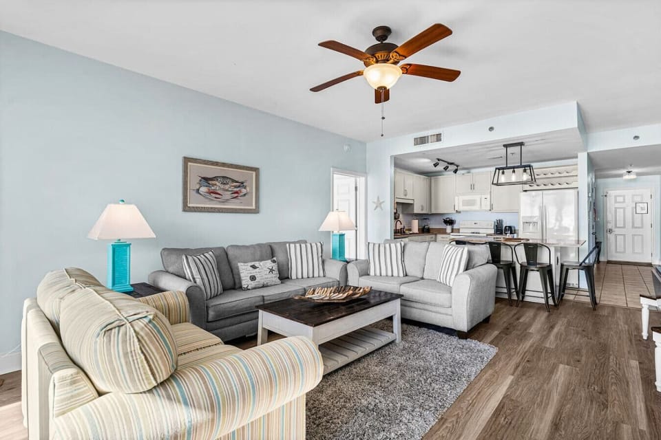 Open Concept Living Area with Sleeper Sofa, Flat Screen TV, Balcony Access and Ocean Views