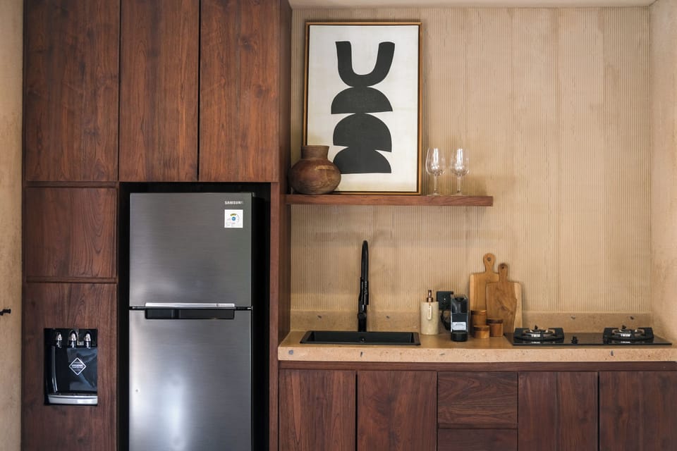 Junior Villa, Pool View | Private kitchen | Fridge, stovetop, coffee/tea maker, blender