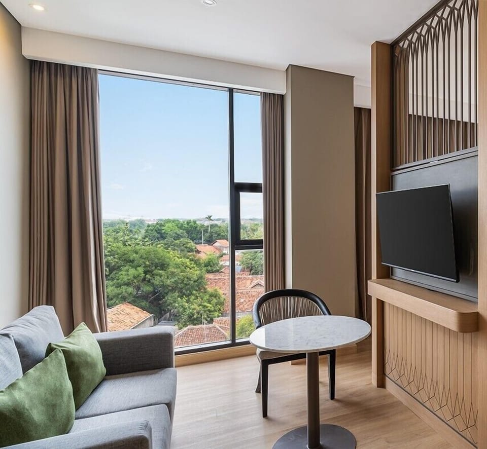 Junior Suite | Living area | 42-inch Smart TV with digital channels