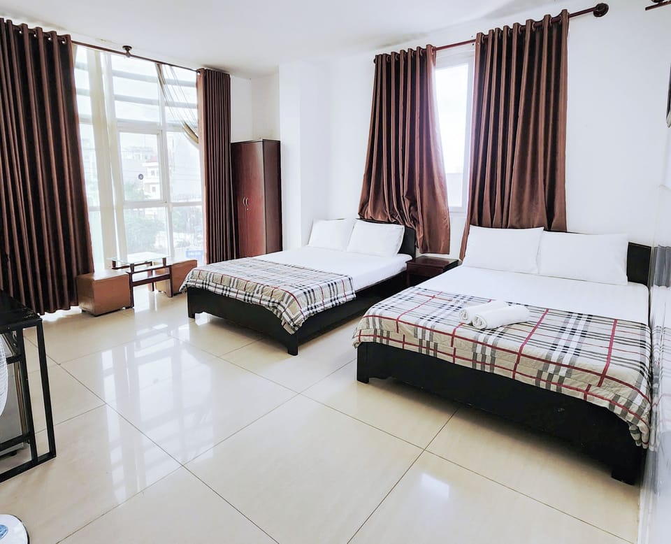 Standard Quadruple Room | Blackout drapes, free WiFi, bed sheets