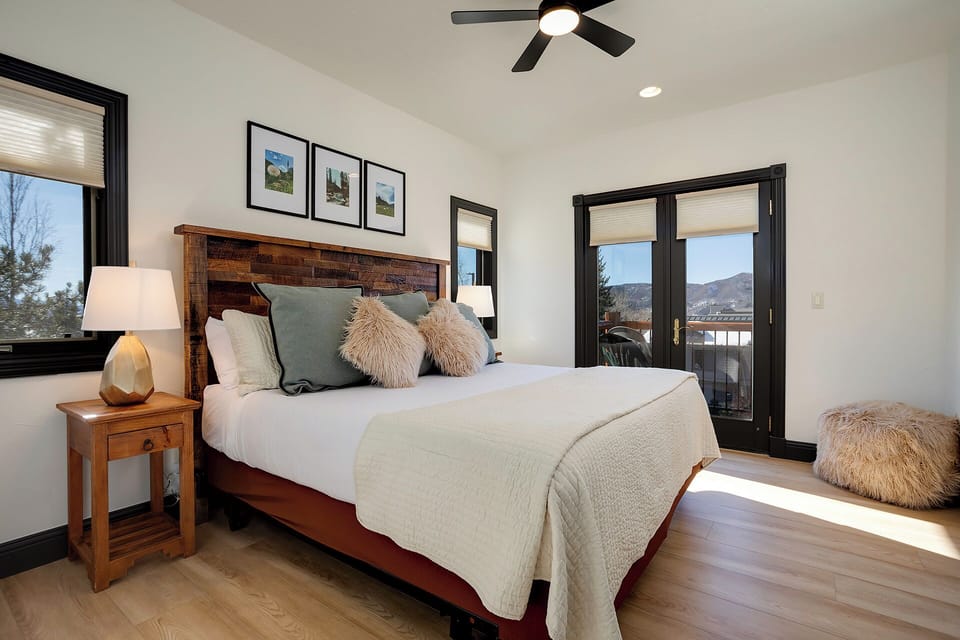 Rest peacefully in your mountain retreat with plush linens and stunning views from your private balcony doors.