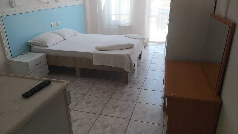 Comfort Quadruple Room, Balcony, Pool View | In-room safe, laptop workspace
