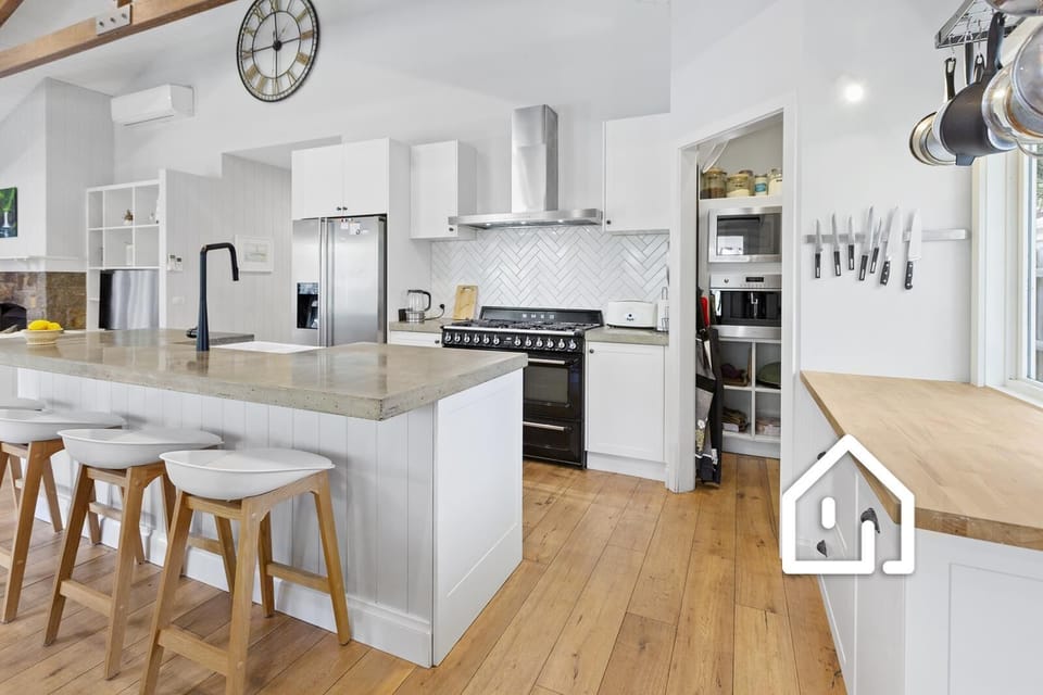 Well-equipped entertainer’s kitchen with quality Smeg appliances 