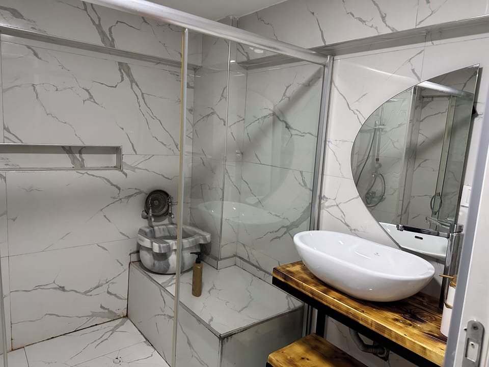 Superior Studio Suite, City View | Bathroom | Slippers
