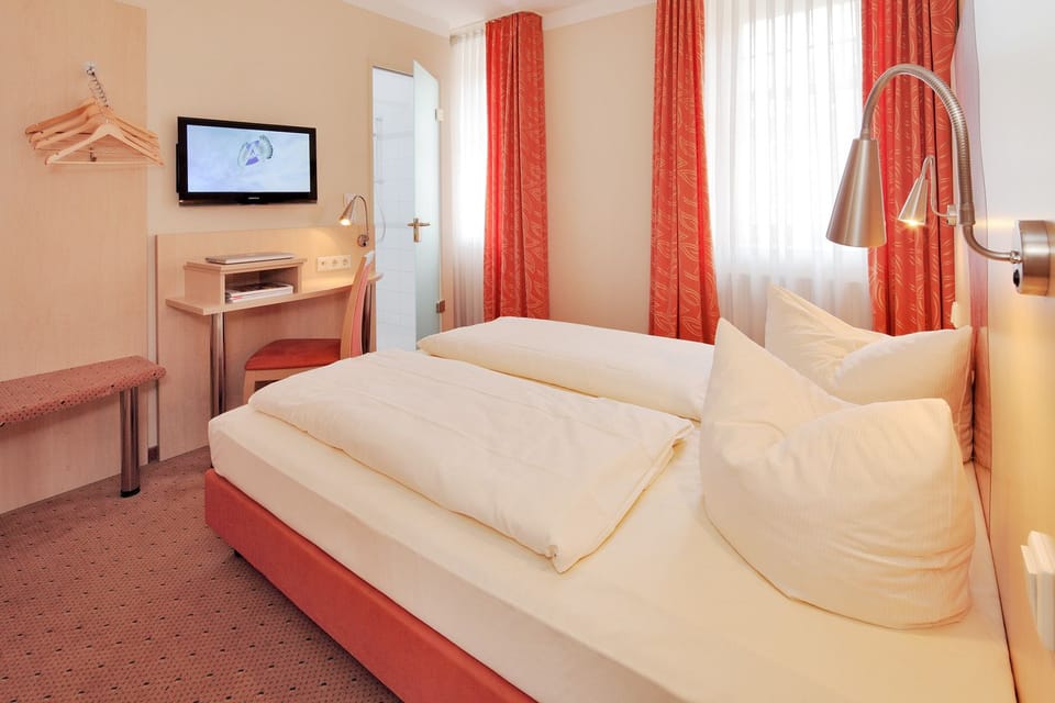 Hypo-allergenic bedding, desk, blackout drapes, soundproofing