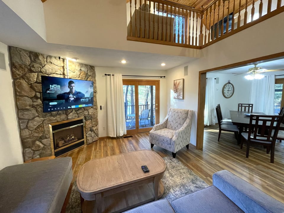 Living Room with Cozy Seating, Queen Sofa Sleeper, TV & Fireplace
