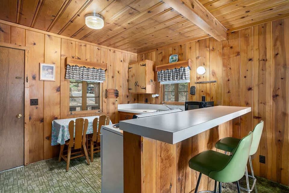 Full kitchen with seating areas.