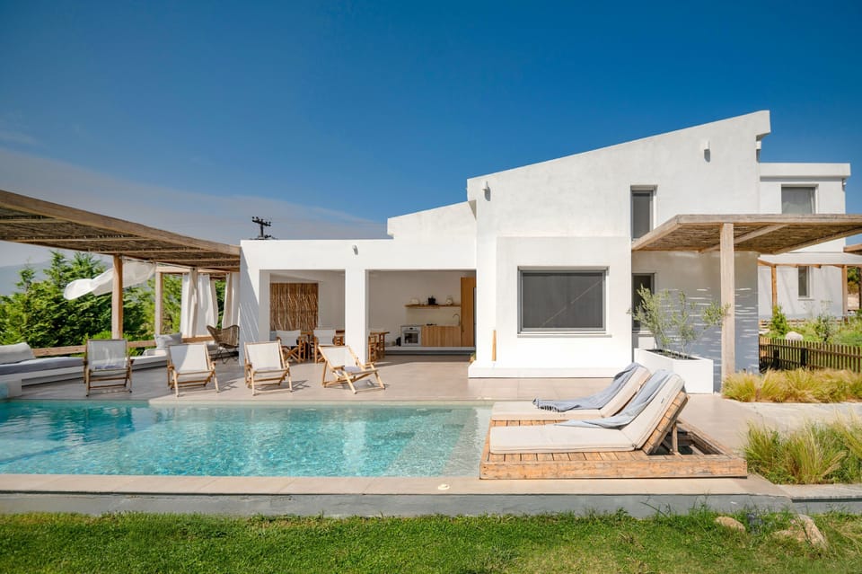 Property perspective to main building and pool area from the property grounds