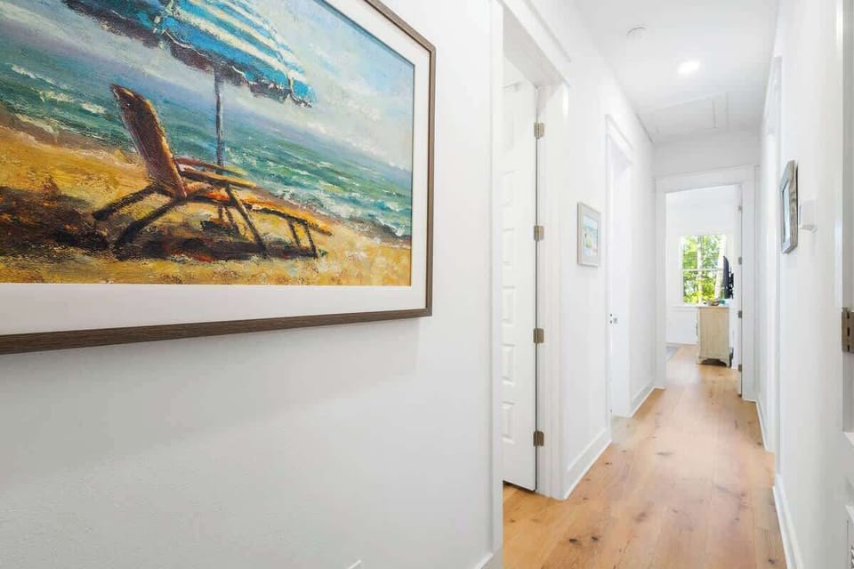 Second floor hallway leads to the homes three bedrooms.
