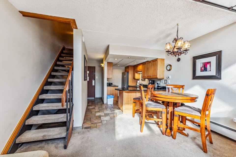 Dining Area: 3-person dining table, adjacent to living room and kitchen