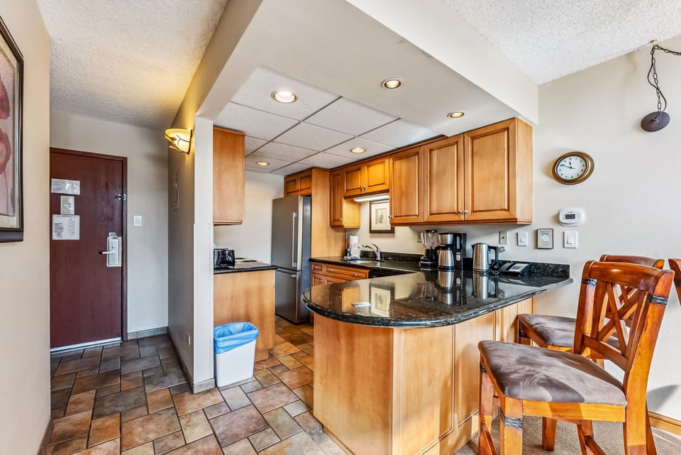 Kitchen: Well-equipped kitchen, updated appliances, drip coffee maker, blender, 2 bar stools