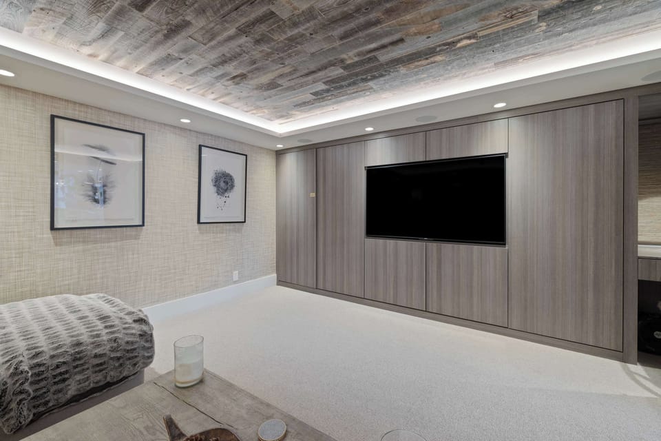 Theater Room: Large sectional couch, 65” Smart TV, Denon sound system