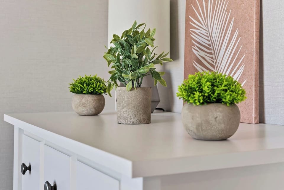 Simple and clean dresser setup with decorative accents—perfect for unpacking and feeling at home.