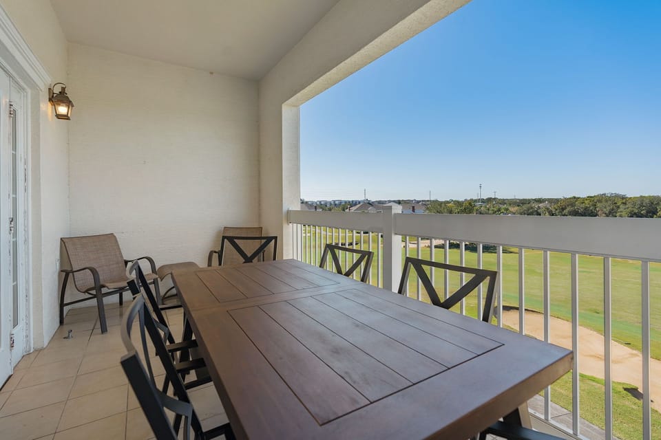 Second balcony angle with golf course and resort views.