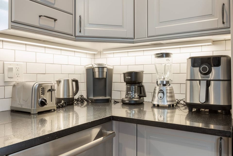 Kitchen features Keurig Coffee Maker, Drip Coffee Maker, Blender, Air Fryer, Electric Tea Kettle and Toaster.