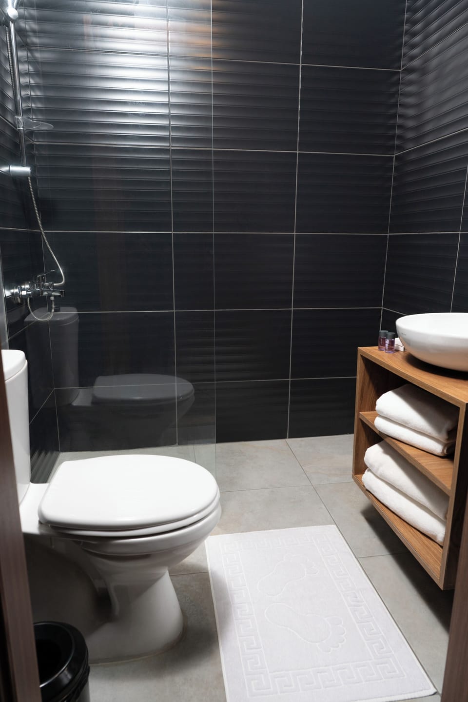 Shower, hair dryer, slippers, towels