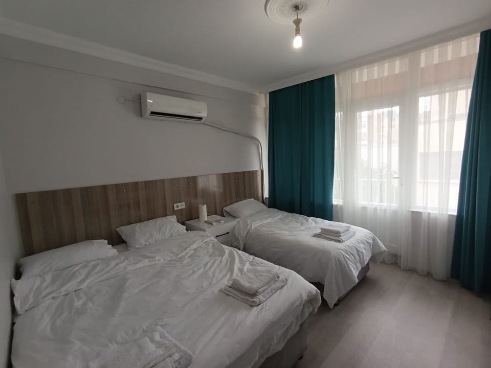 Family Room, Multiple Bedrooms, Balcony, City View | Laptop workspace, WiFi (free), bed sheets