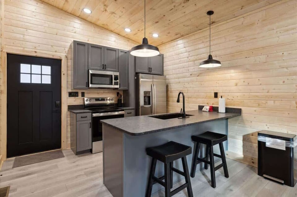 Kitchen: Bright and sleek space for culinary adventures with modern appliances and stylish seating!