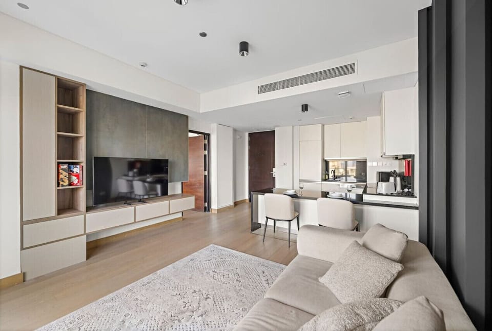 Living Room: Modern elegance with sleek decor, a great space to unwind after exploring Dubai!