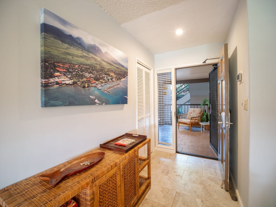 Welcoming entrance featuring tropical decor and local artwork, creating a warm and inviting atmosphere for your stay.