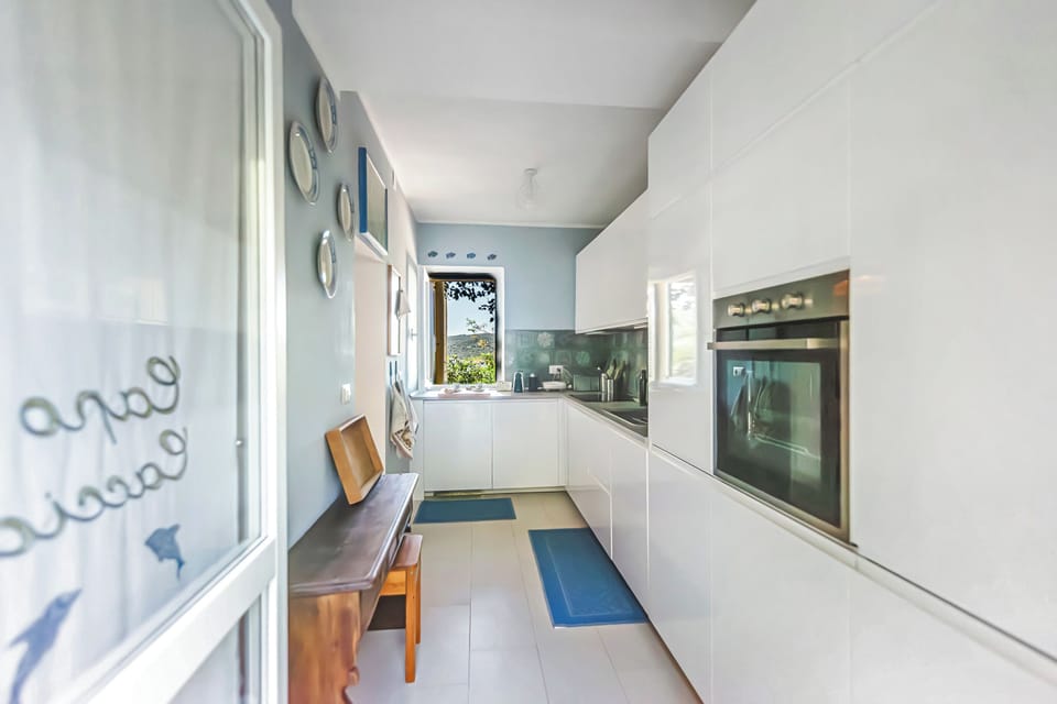 Family Villa, Multiple Bedrooms (Una Finestra Sul Mare Capocaccia) | Private kitchen | Fridge, microwave, oven, stovetop