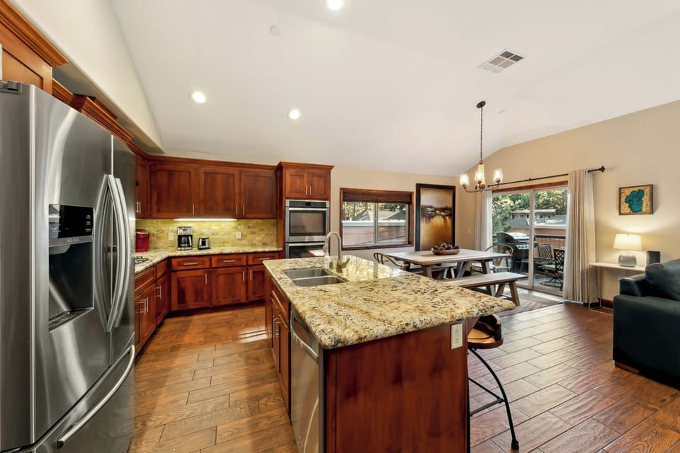 Gather around your gourmet kitchen with granite countertops and stainless appliances, perfect for cooking memorable meals together.