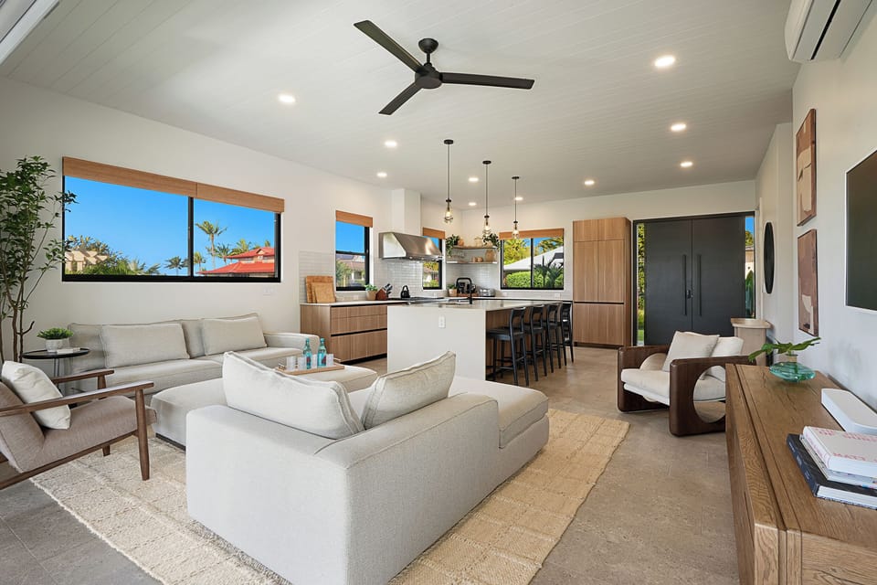 Modern and inviting living room with ample seating and warm, natural accents.