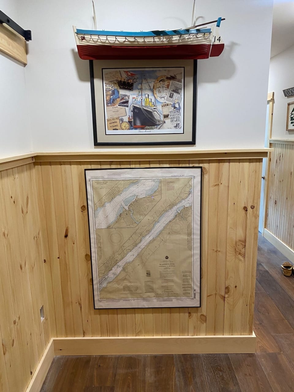 Titanic lifeboat and print.  Chart of St. Lawrence River which divides US & CAN.