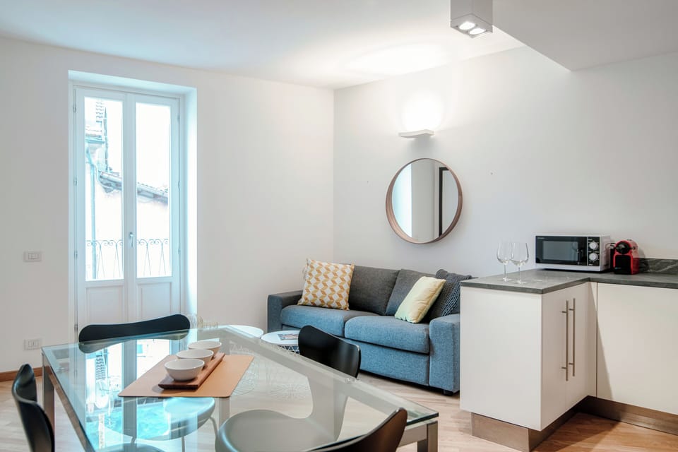 Apartment, Balcony, Partial Lake View | Living area | 30-inch TV with digital channels