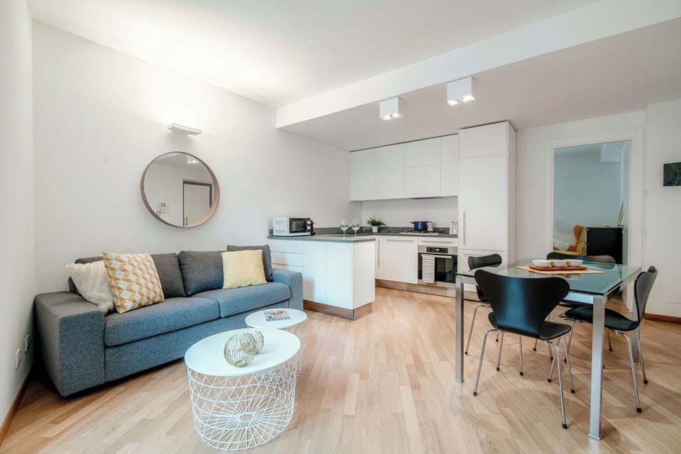 Apartment, Balcony, Partial Lake View | Living area | 30-inch TV with digital channels