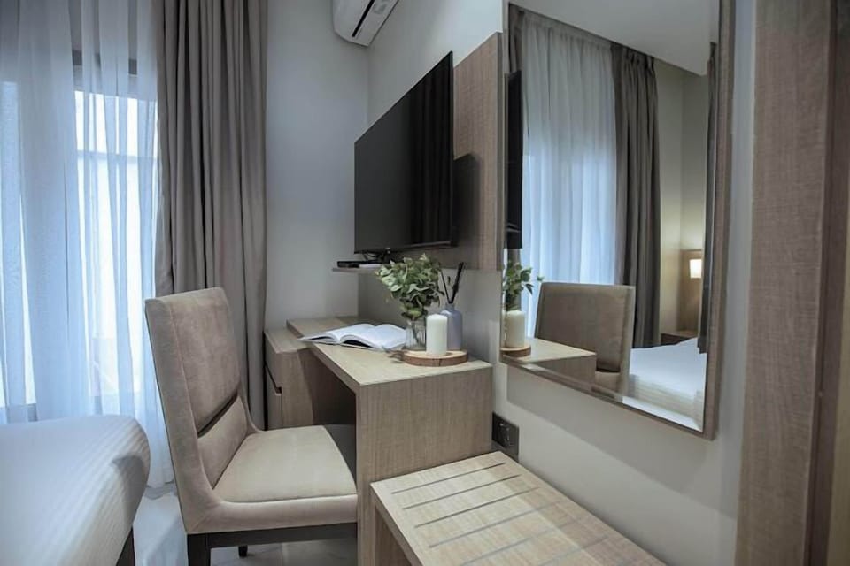 Economy Room, Balcony, City View | Desk, laptop workspace, free WiFi