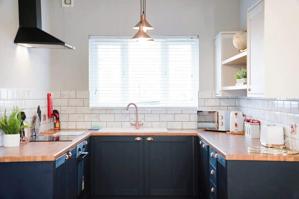 Kitchen equipped with all essentials, including a washer & dryer, oven, fridge and full cookware set.
