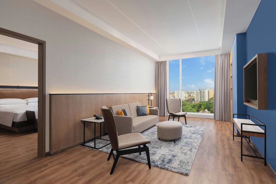 Suite, 1 King Bed, City View | Living room | 54-inch Smart TV with digital channels
