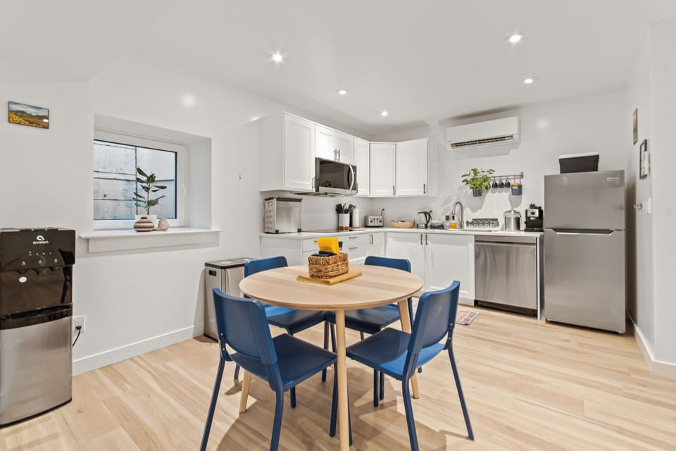 Bright modern kitchen with dining for 4 and stainless steel appliances