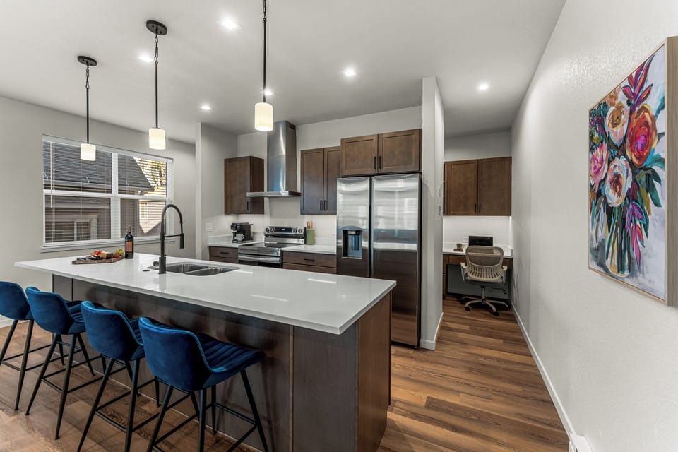 Modern kitchen with stainless steel appliances for all your culinary needs!