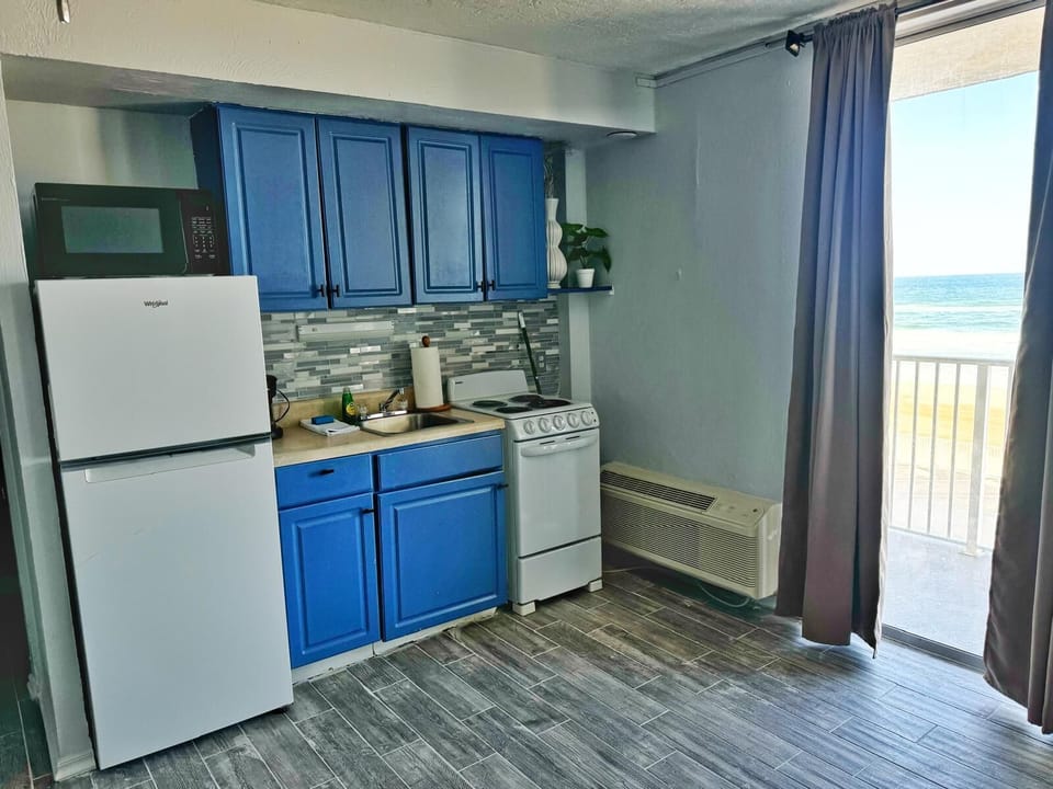 Stove, microwave, full size refrigerator, toaster, coffee maker and Keurig