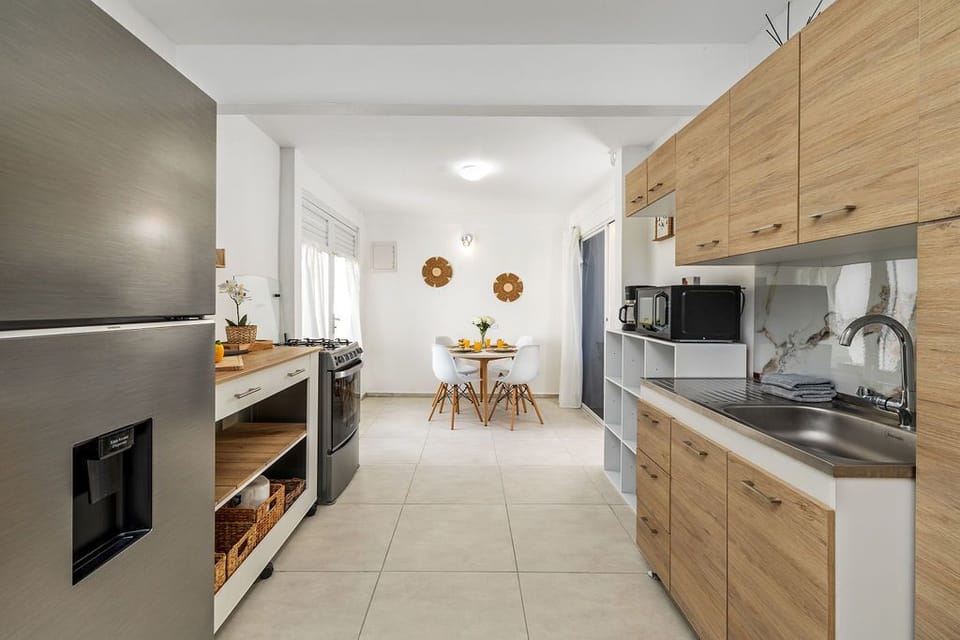 Our bright and inviting kitchen offers the perfect blend of comfort and practicality. Fully stocked with essential utensils, cookware, and dinnerware.