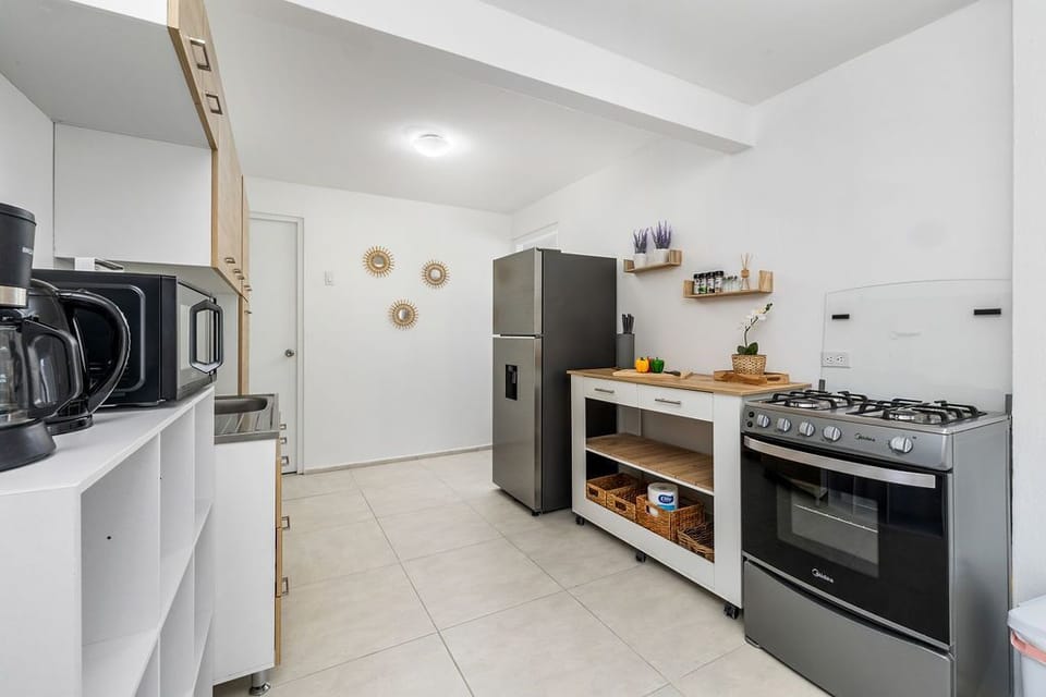 The open layout connects seamlessly with the dining area, making it easy to cook and socialize with family or friends at the same time.