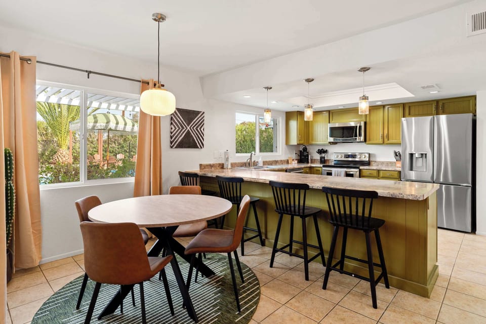 An open floor concept that connects living, dining, and kitchen areas for a bright, inviting atmosphere.