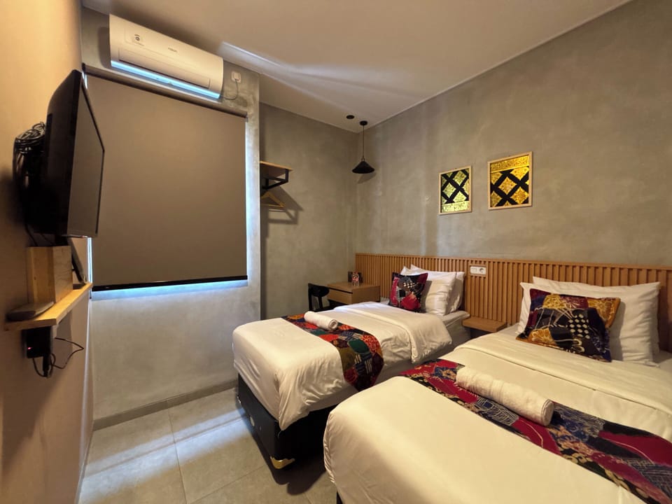 Twin Room | Desk, blackout drapes, iron/ironing board, free WiFi