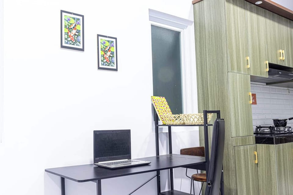 Villa | Living area | 32-inch LCD TV with cable channels
