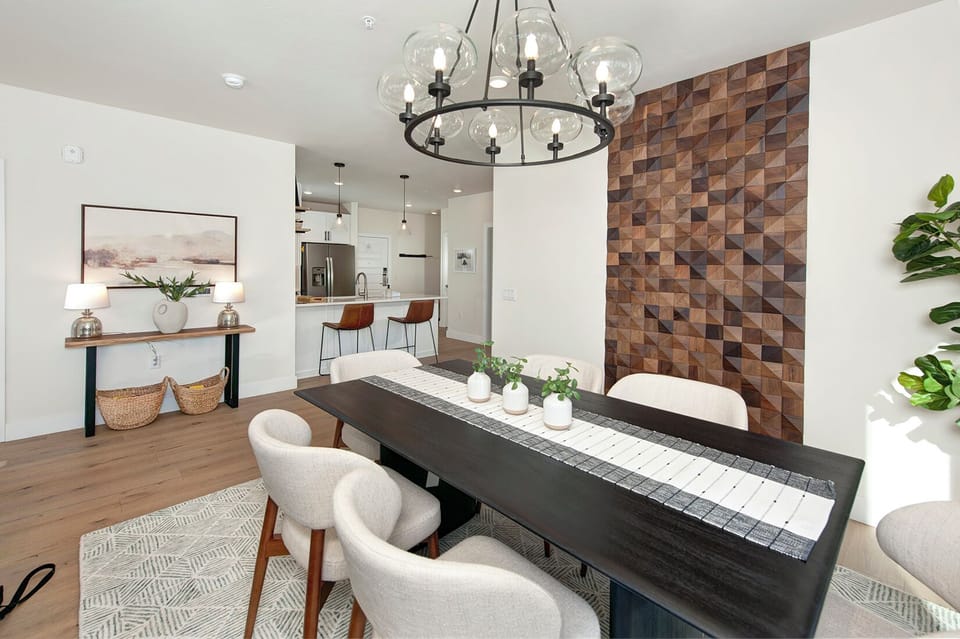 Beautiful dining room with large wood table and seating for up to 6 people.