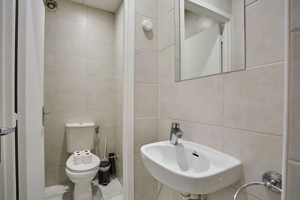 Apartment | Bathroom | Bathtub, hair dryer, towels, soap