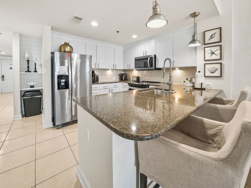Your fully-equipped kitchen awaits with granite countertops, stainless appliances, and breakfast bar seating for memorable meal prep.
