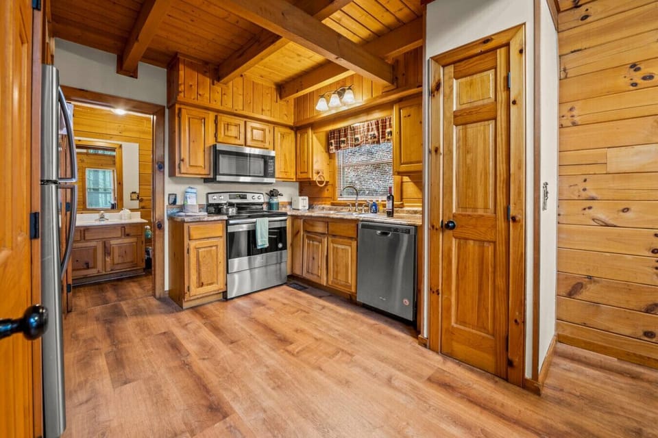 Fully equipped kitchen with stainless steel appliances.